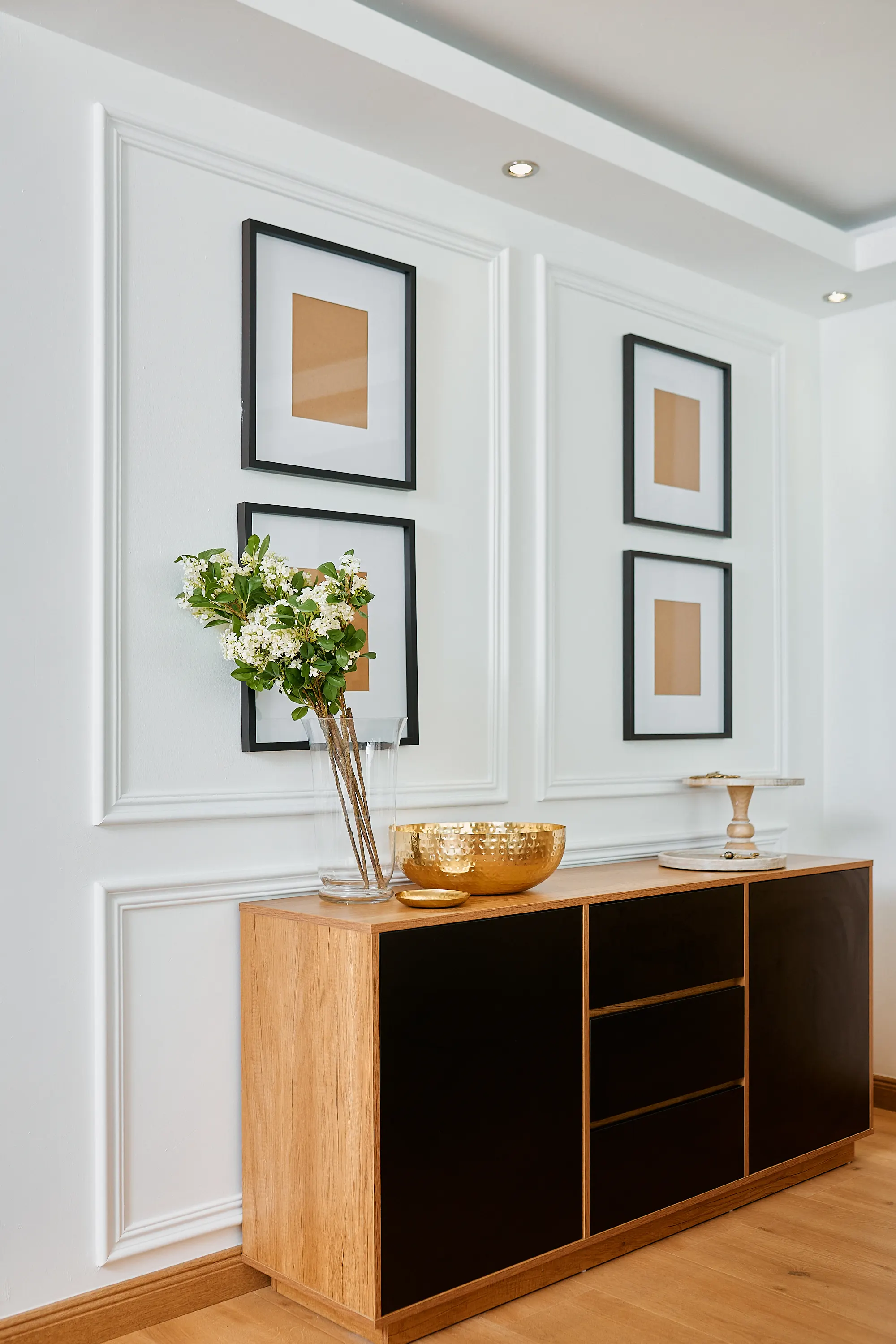 The Modern Classic Project — hallway console with panelled wall and gold accents